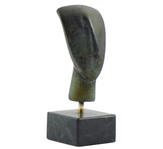 Cabeza de ídolo femenino en bronce, tipo...