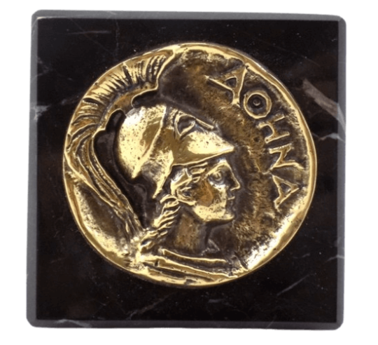 Paperweight, bronze coin featuring Athena, goddess of wisdom, military strategy, and the arts
