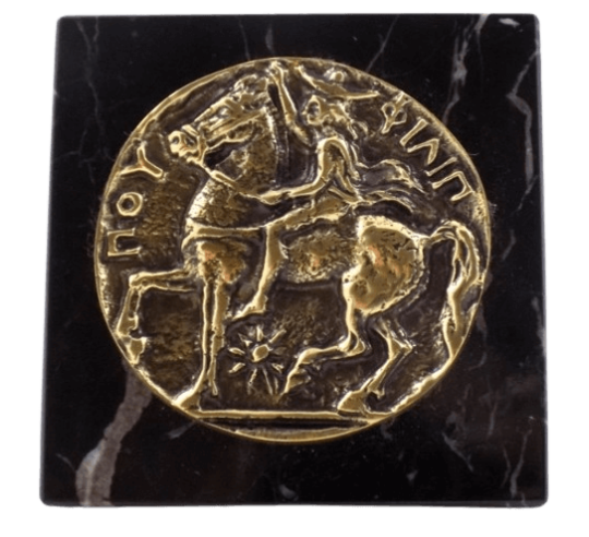 Pisapapeles, moneda de bronce con la efigie de Felipe II, rey de Macedonia y padre de Alejandro Magno