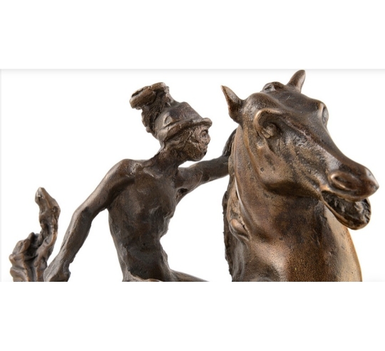 Patinated Bronze Sculpture: Horse and Rider...