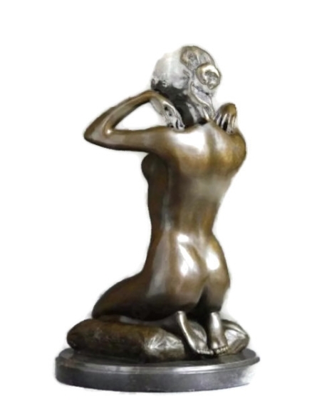 Woman kneeling on a cushion and adjusting her necklace - Paul Ponsard