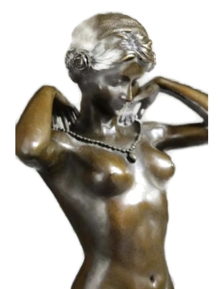 Woman kneeling on a cushion and adjusting her necklace - Paul Ponsard