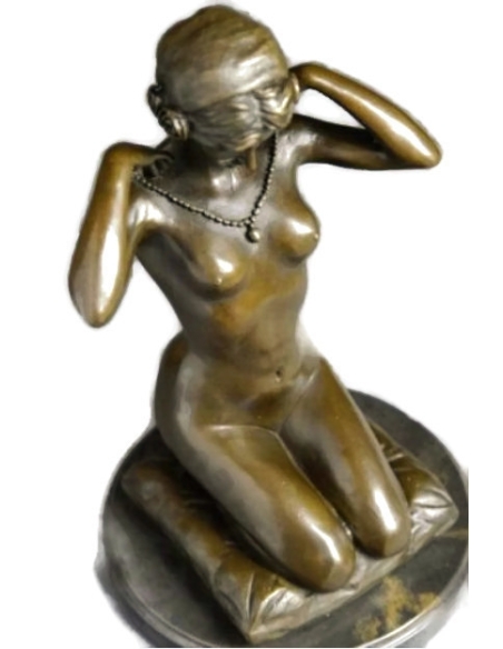 Woman kneeling on a cushion and adjusting her necklace - Paul Ponsard