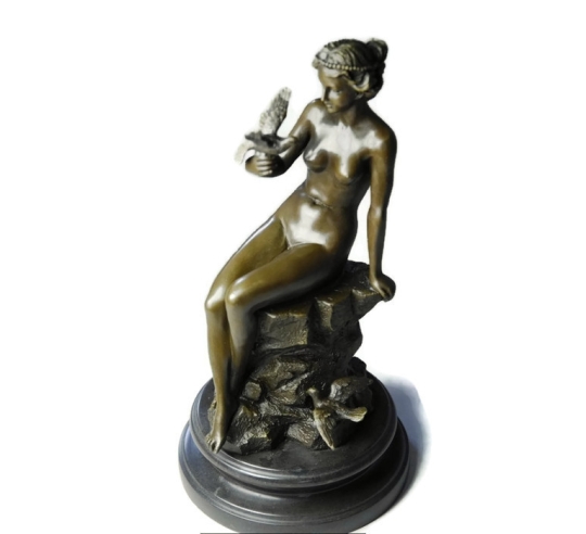 Young woman naked with dove by Ferdinand Preiss