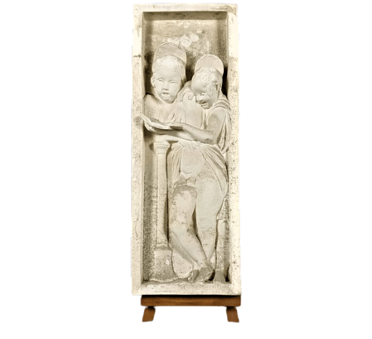 Bas relief of angels singing Bible verses