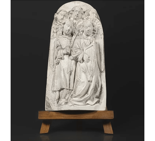 Bas relief choir of angels singing Bible verses and playing the lyre