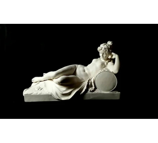 Statue of a nude woman lying on a lion skin by...