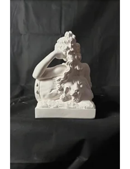 Statue of a nude woman lying on a lion skin by Claude Michel called Clodion