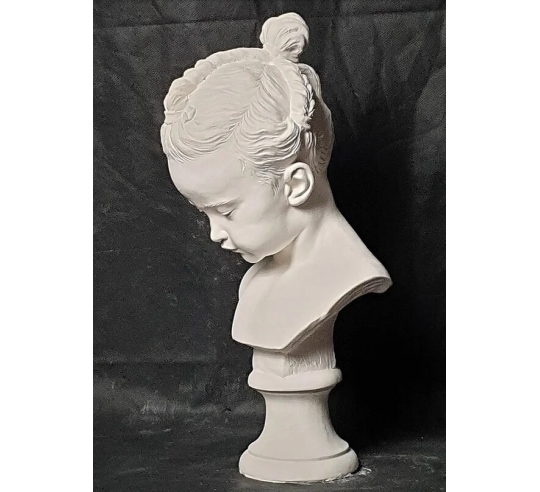 Bust of a little girl with pigtails called the...