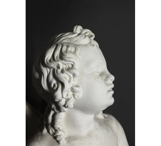 Statue of Cupid with his bow or Amorino after...