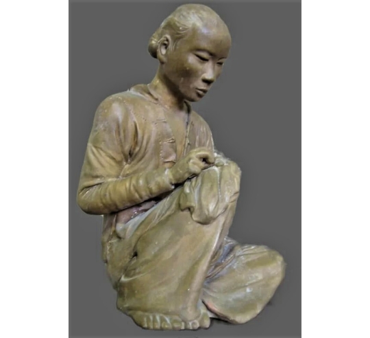 Statue of an Annamite seamstress after Félix...