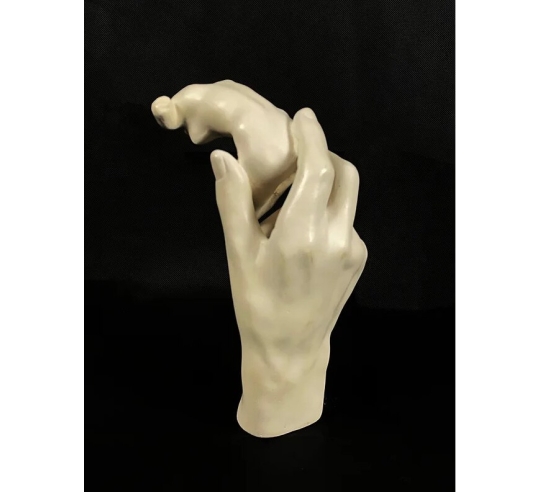 Sculpture of Rodin's Hand holding a female...