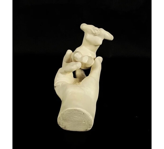 Sculpture of Rodin's Hand holding a female...