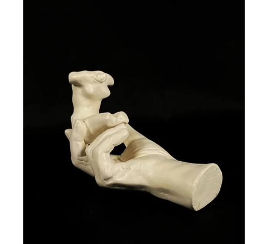 Sculpture of Rodin's Hand holding a female...