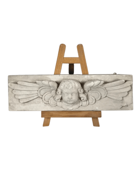 Low relief of an angel's head in Renaissance style
