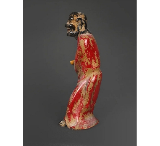 Statuette of a beggar with his begging bowl,...