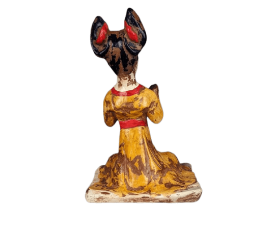 Statuette of a seated female musician playing...