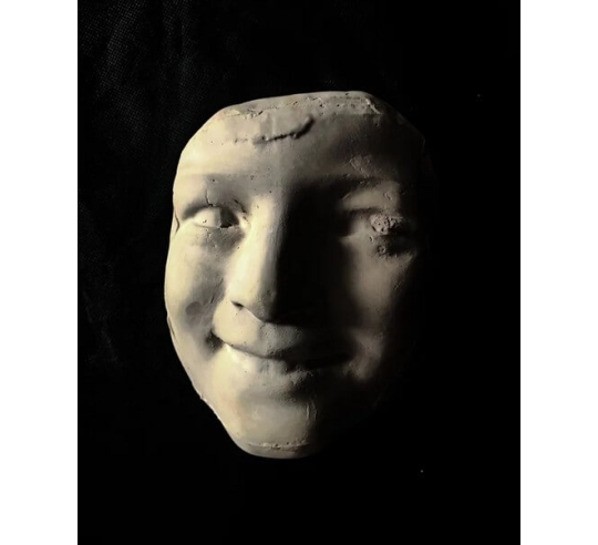 Mask of Laughing Girl with Roses after...