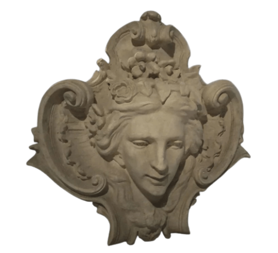 Mascaron orné du visage de la déesse Flora, allégorie de la nature