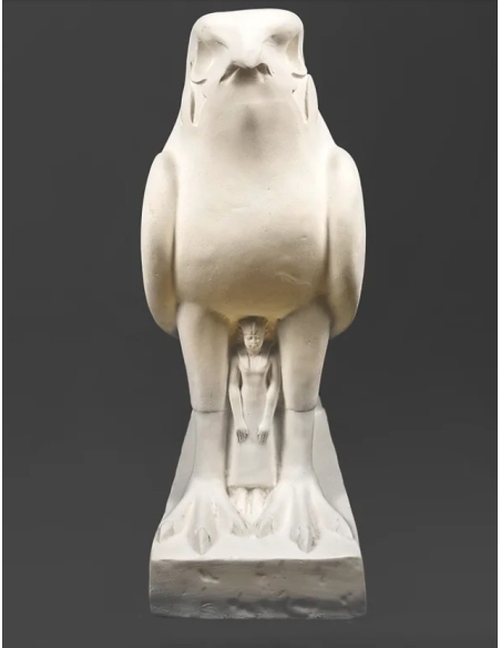 Statue of the god Horus protecting the Egyptian king Pharaoh Nectanebo II