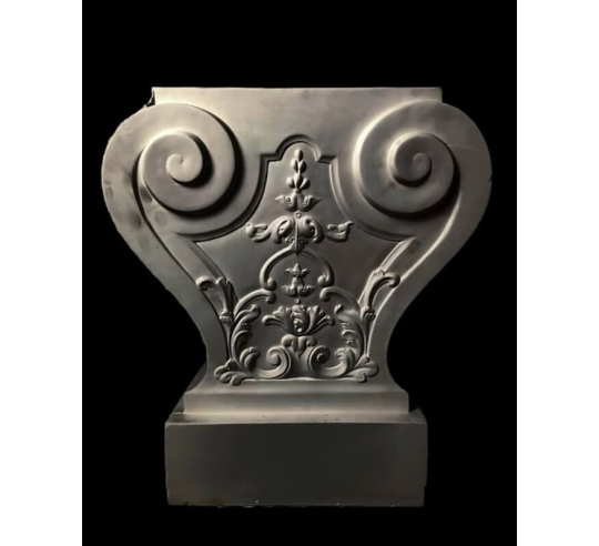 Leg of a garden bench decorated with floral...