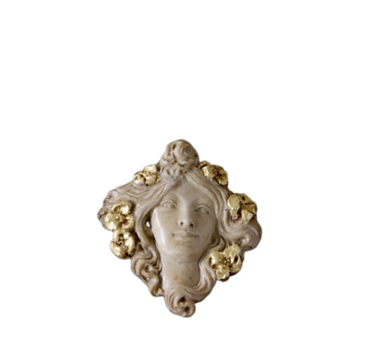 Medallion face of Muse with flowers in the hair.