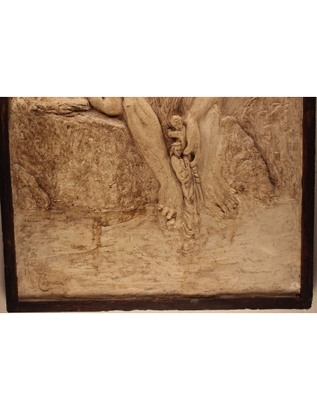 Bajorrelieve Anteo depositando a Dante en el cocyte "La Divina Comedia".