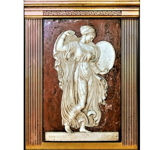 Low-relief Menadus playing the drum,...