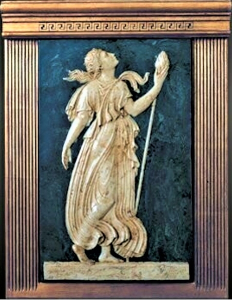 Low relief Maenad holding a  thyrse attribute of Dionysus.