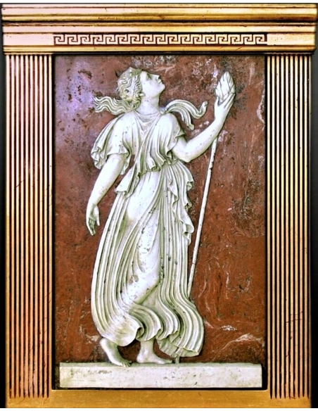 Low relief Maenad holding a Thyrsus, attribute of Dionysus.