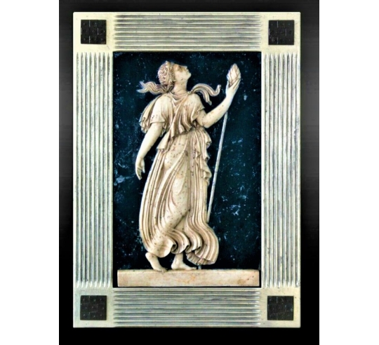 Low relief Maenad holding a sceptre, the thyrse...