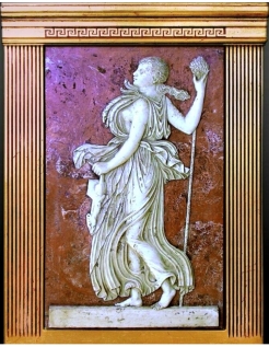 Low relief Maenad holding a Thyrse.