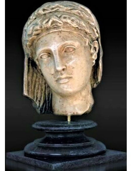 Head of a funerary or votive statue of a young aristocratic woman, ancient Greek style.