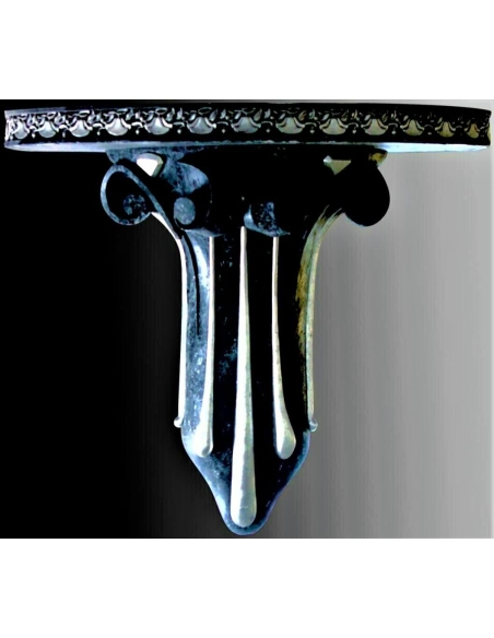 Wall bracket in the neoclassical style, decorated with scrolls and in the form of gold drops with a cobalt blue and gold patina.