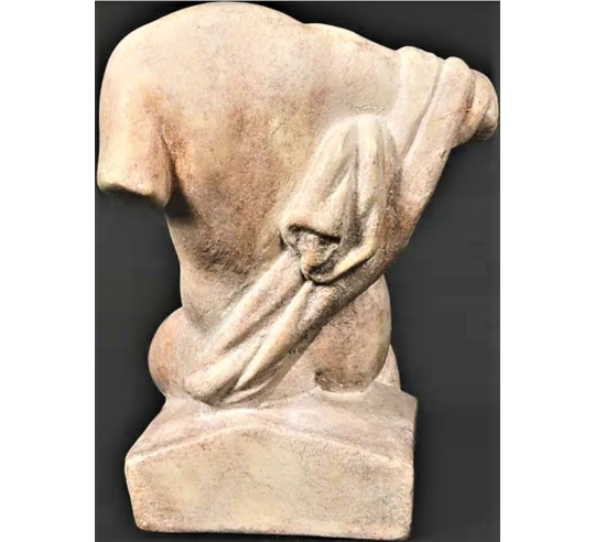 Torso of Venus seated without head.