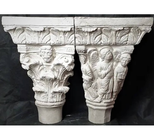 Twin capitals adorned with angels and saints -...