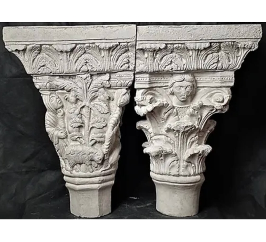 Twin capitals adorned with angels and saints -...